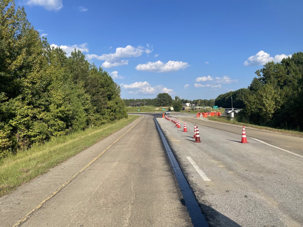 View of the NCAT test track with VRAM spray on the edge of the left driving lane