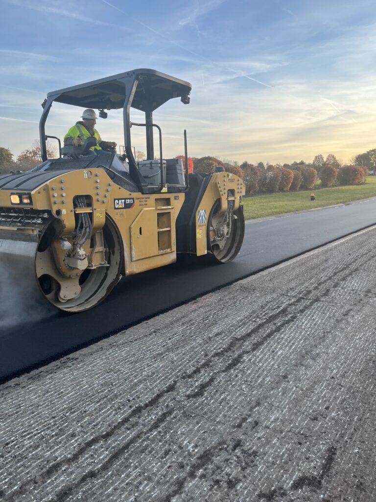 milestone roller compacts the hma surface course