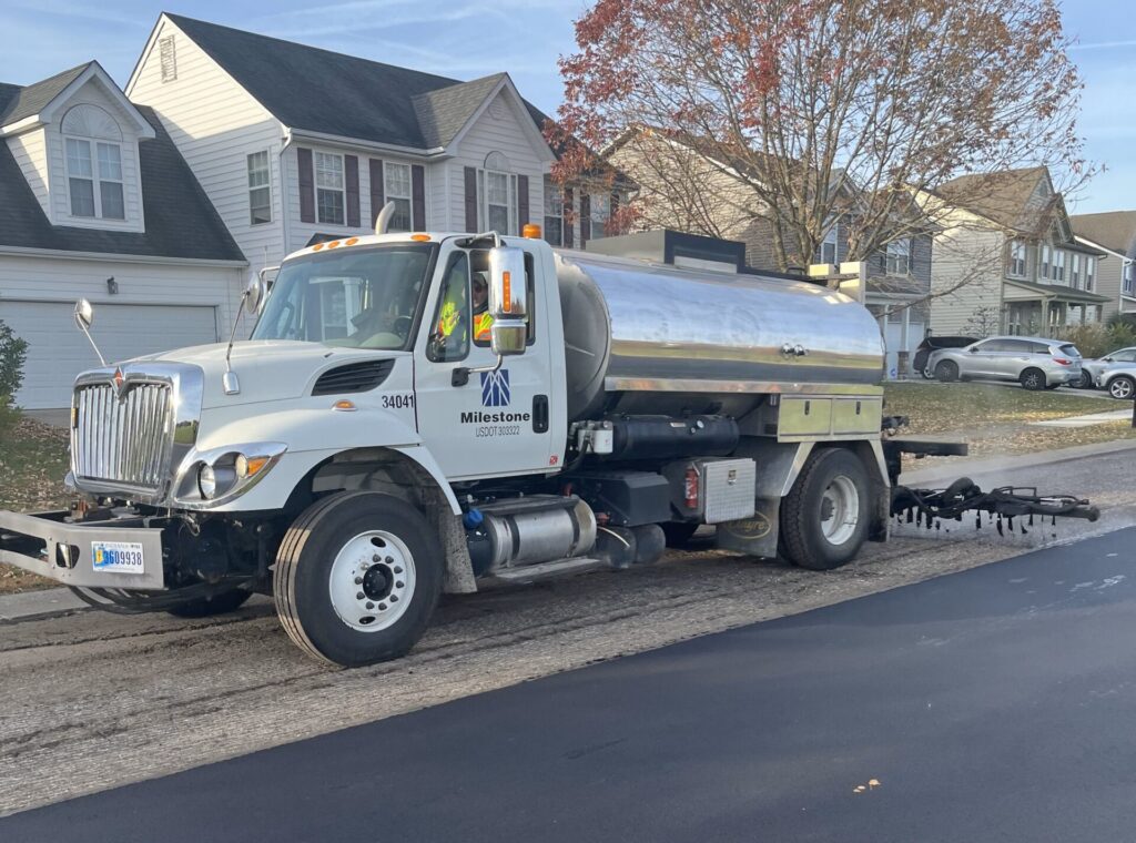 Tack Coat distributor from Milestone applies a thin asphalt emulsion to the road