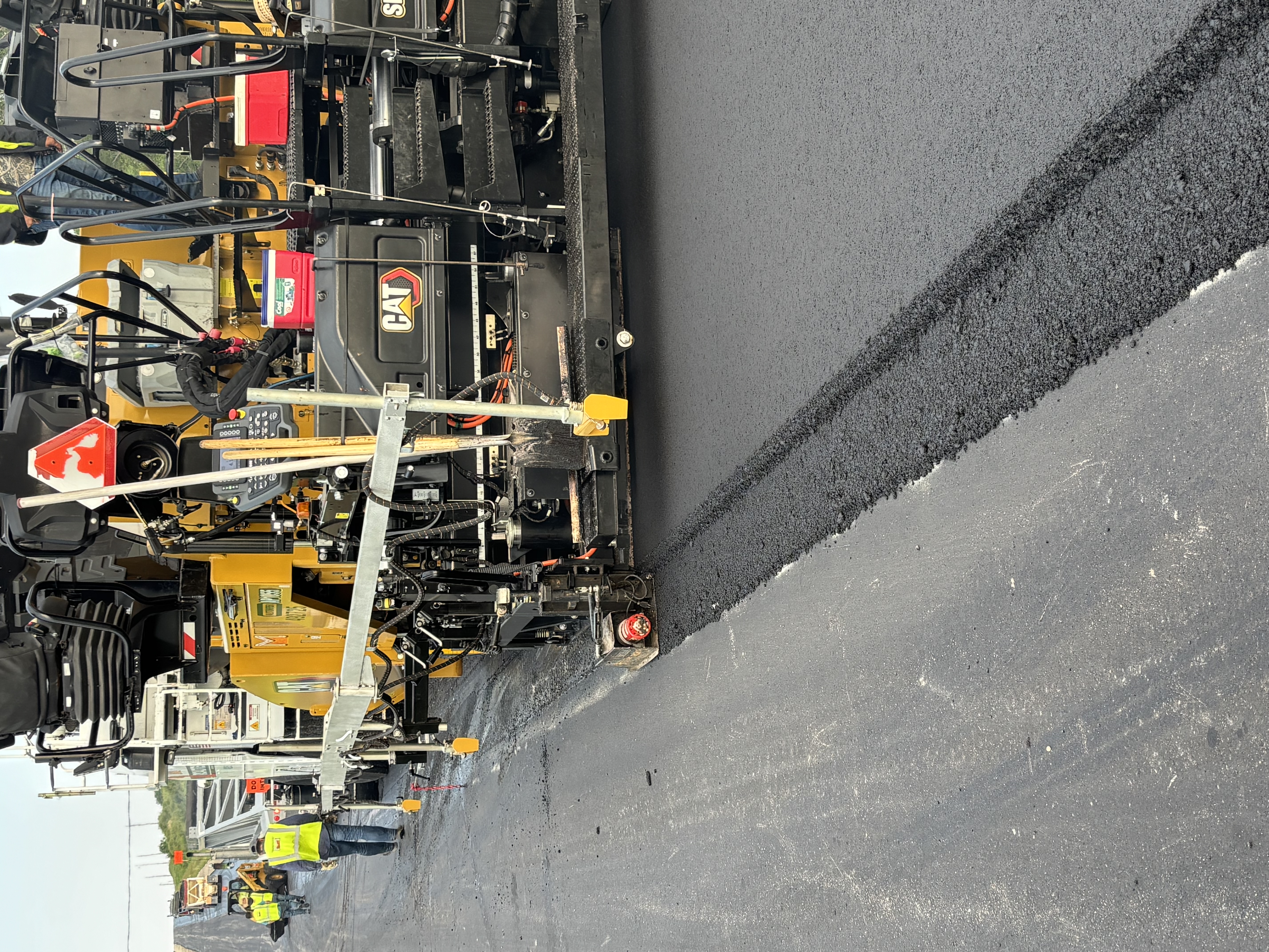 Paving a notched-wedge joint for traffic safety and reinforcing with VRAM